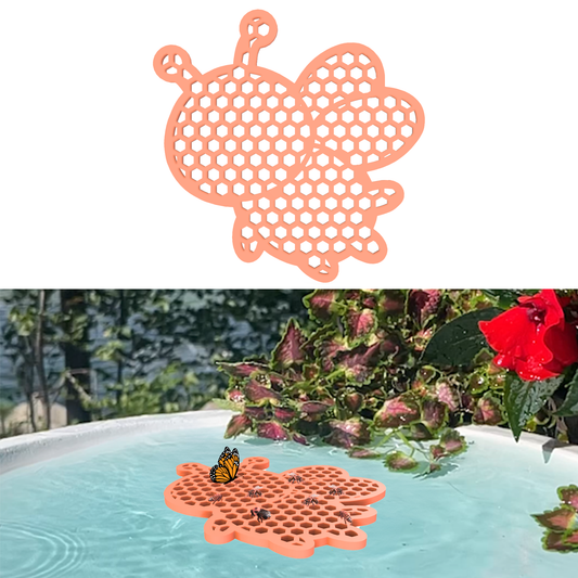 An orange honeybee-shaped bee watering station (bee pontoon) in a birdbath against a flower background.