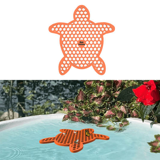 Orange turtle-shaped bee watering station (bee pontoon) in a birdbath against flower background
