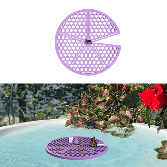 A purple lily pad-shaped bee watering station (bee pontoon) in a birdbath against a flower background.