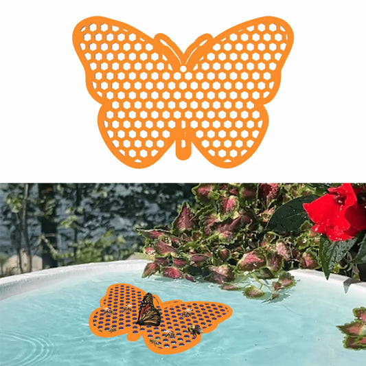 An orange butterfly-shaped bee watering station (bee pontoon) in a birdbath against a flower background.